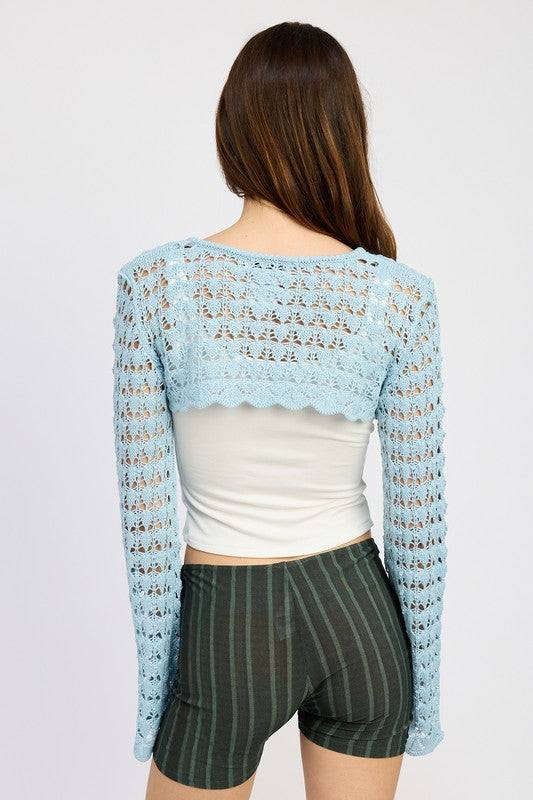 Emory Park light blue Crochet Bolero With Drawstrings worn over white tank top and striped shorts