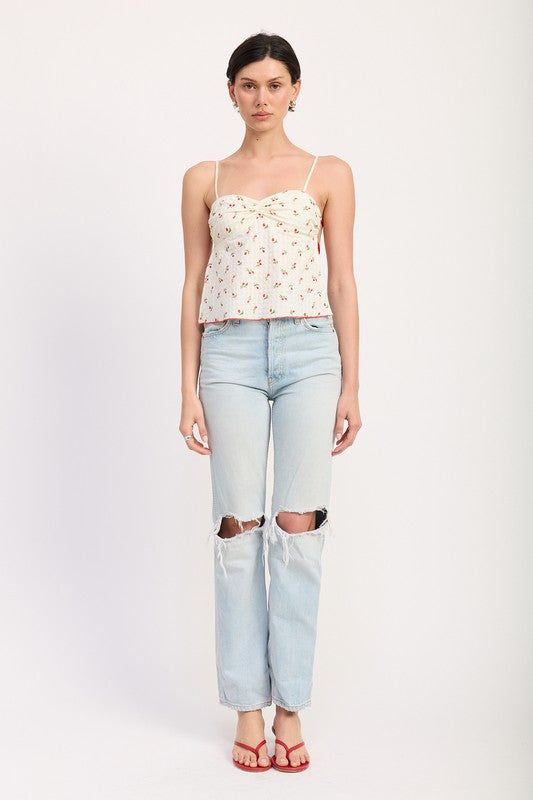 Emory Park Floral Sweetheart Cami Top paired with light washed ripped jeans and red sandals