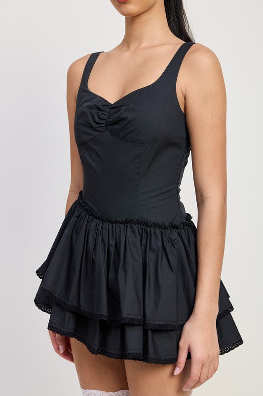 Emory Park Mini Asymmetrical Sleeveless Dress in black with ruched bust and layered skirt
