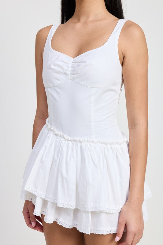 Emory Park Mini Asymmetrical Sleeveless Dress in white with layered skirt and fitted bodice
