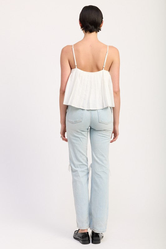 Back view of woman wearing Emory Park Pleated Tie Front Cami Top in white with light blue jeans