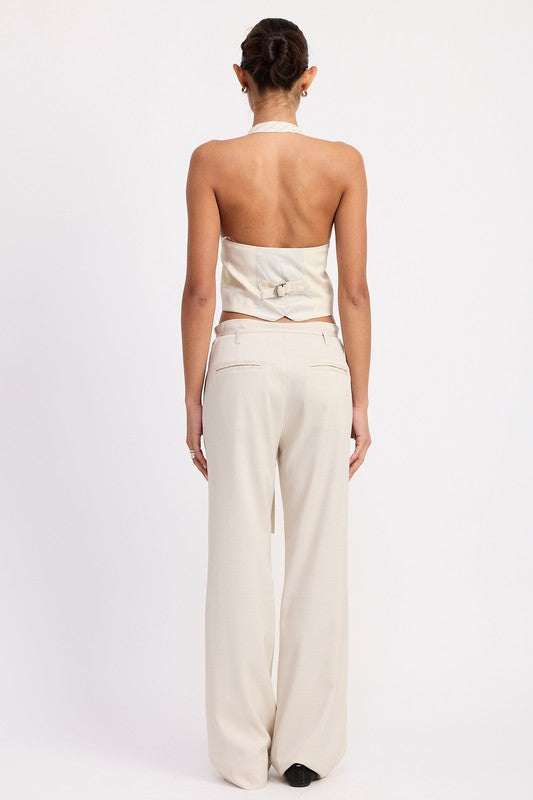 Back view of model wearing Emory Park wide leg drawstring trousers with belt loops in beige