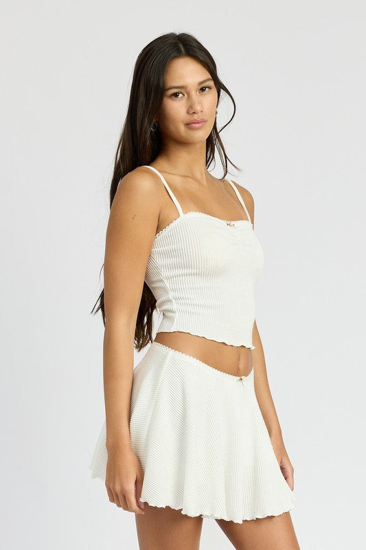 Emory Park Cinch Front Cami Top in white ribbed fabric worn by model with matching skirt