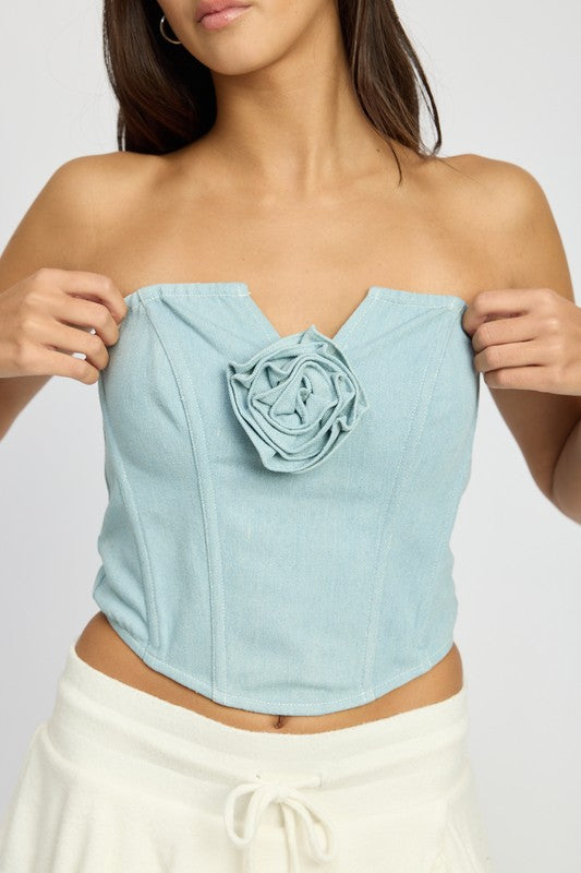 Emory Park light blue Denim Corset Top With Rosette Detail worn by model with strapless design