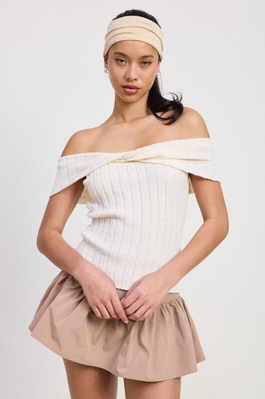 Emory Park off shoulder sweater top in cream ribbed knit worn with beige ruffled skirt