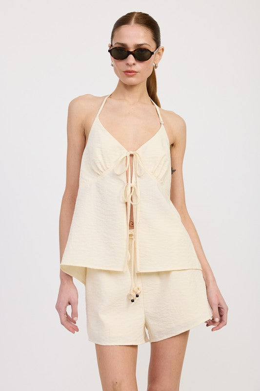 Emory Park Halter Neck Top with Back Tie in cream worn with matching shorts and black sunglasses