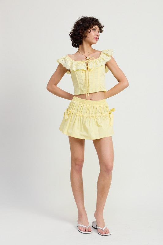 Emory Park Square Neck Ruffle Corset Top in light yellow worn with matching skirt