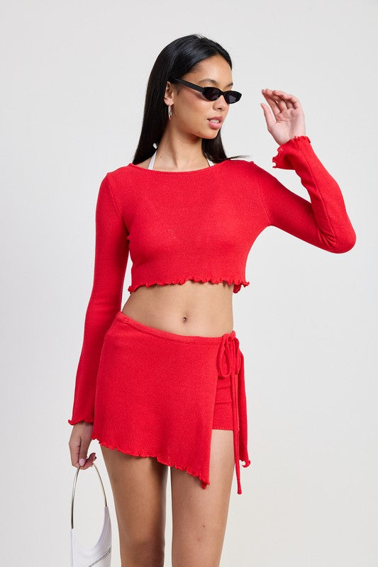 Emory Park red Long Sleeve Boat Neck Cropped Top worn with matching skirt and black sunglasses