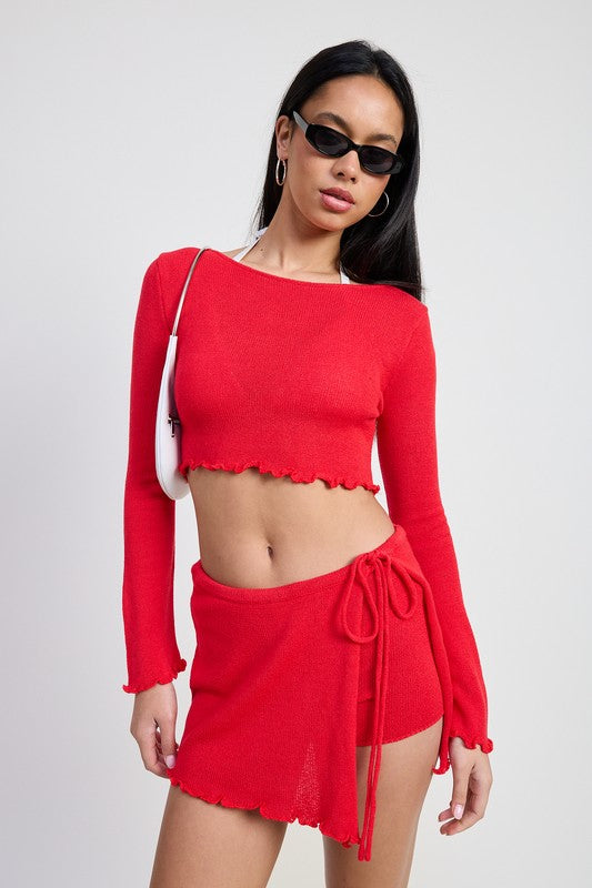 Emory Park red Long Sleeve Boat Neck Cropped Top with matching skirt worn by model with sunglasses