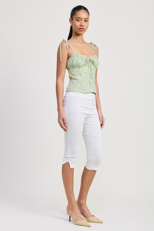 Emory Park Bustier Top With Shoulder Ties in light green floral print paired with white cropped pants