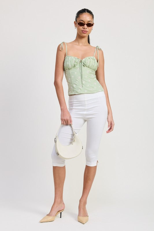 Emory Park Bustier Top With Shoulder Ties in light green worn with white capri pants and beige heels