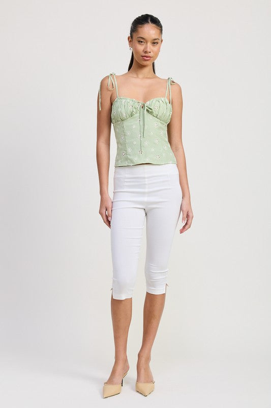 Emory Park Bustier Top With Shoulder Ties in light green worn with white capri pants and nude heels
