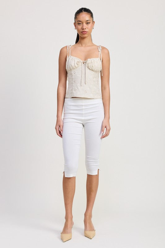 Emory Park Bustier Top With Shoulder Ties in beige worn with white cropped pants and beige heels