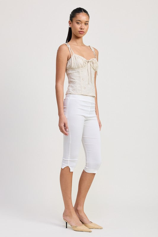 Emory Park Bustier Top With Shoulder Ties in cream worn with white cropped pants and beige heels