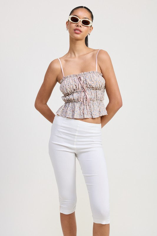 Emory Park Floral Tiered Ruffle Top with spaghetti straps worn with white fitted capri pants