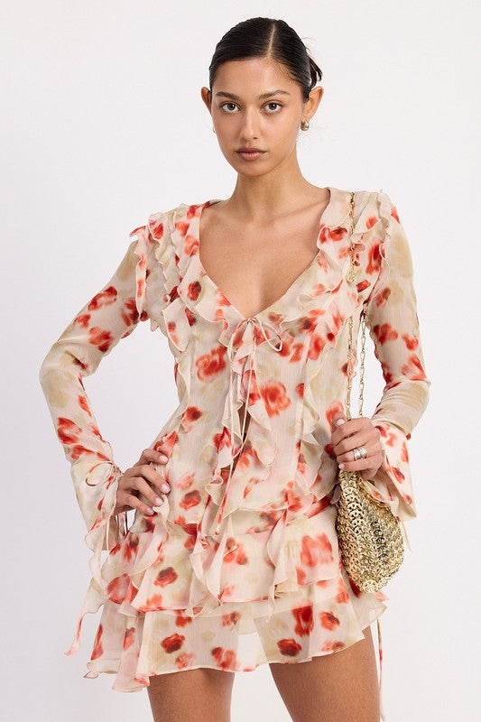 Emory Park Ruffle Trim Sheer Peplum Top with floral print and long sleeves on model