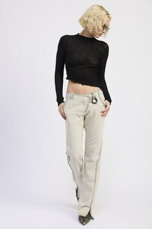 Emory Park Long Sleeve Boat Neck Top in black lace paired with stylish light-colored pants