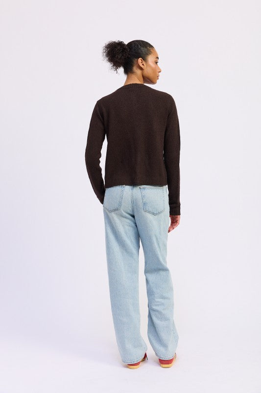 Brown Fitted Button-Up Cardigan by Emory Park worn with light blue jeans from the back view