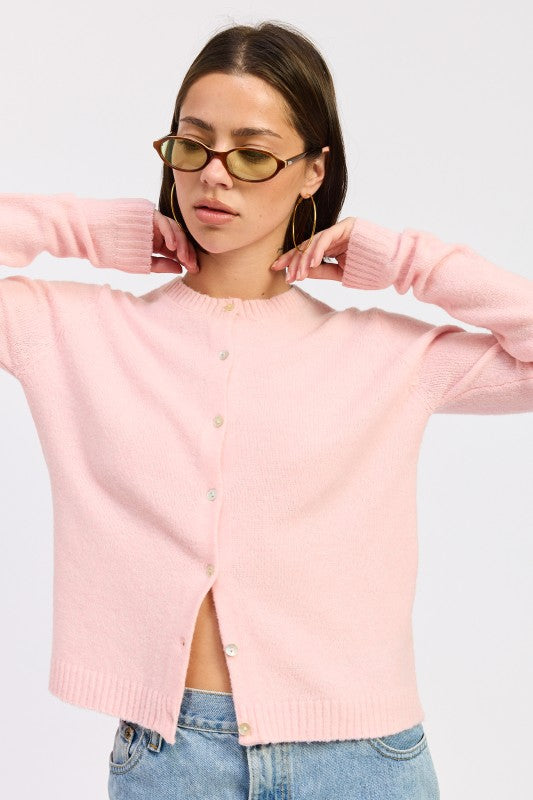 Emory Park Fitted Button-Up Cardigan in soft pink with round neckline and button closure hands up