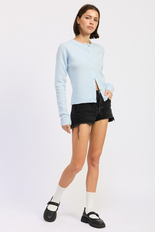 Light blue Fitted Button-Up Cardigan paired with black denim shorts for a stylish casual look