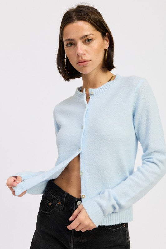Light blue fitted button-up cardigan by Emory Park with a classic crew neckline and button closure