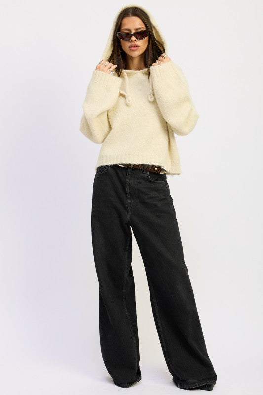 Cozy cream Fringe Hoodie With Drawstrings styled with loose black jeans for a chic look
