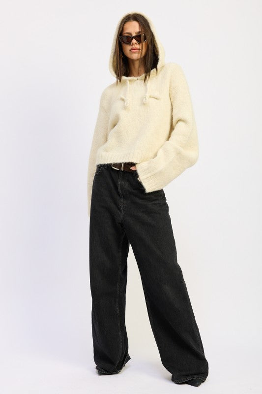 Cozy Emory Park Fringe Hoodie With Drawstrings in Cream Color, Paired with Black Wide-Leg Pants