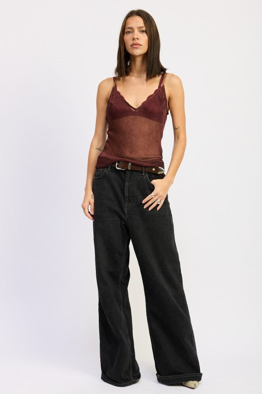 Emory Park Metallic Chainmail Bias Cami Top in burgundy with a lace trim, styled with wide-leg jeans