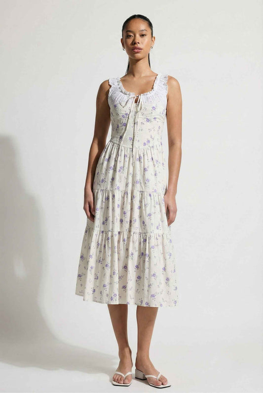 Woman wearing a Adeline Midi | Ivory Floral Eyelet Tiered Dress against a white background