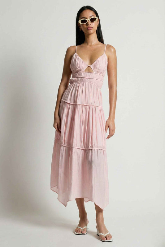 Woman wearing a Aria Maxi Pink Tiered Cutout Dress with a white background