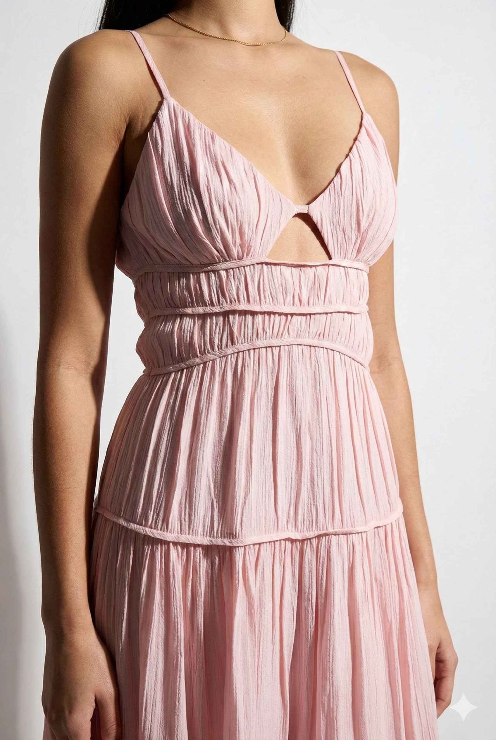Aria Maxi Pink Tiered Cutout Dress with thin straps and cut-out design on a white background