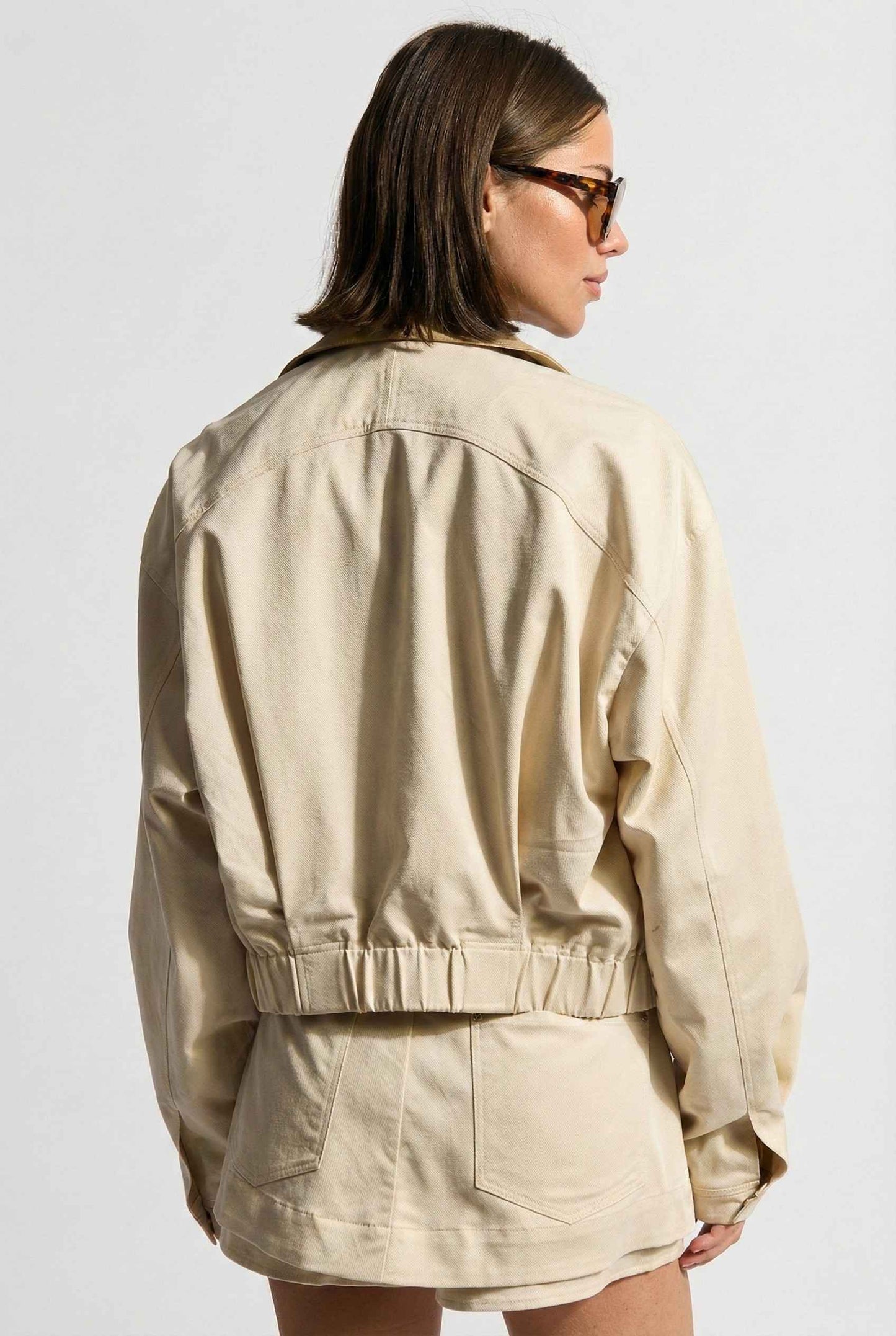 Model wearing Arlo Jacket | Beige Lyocell-Blend Jacket with Contrast Collar with shorts