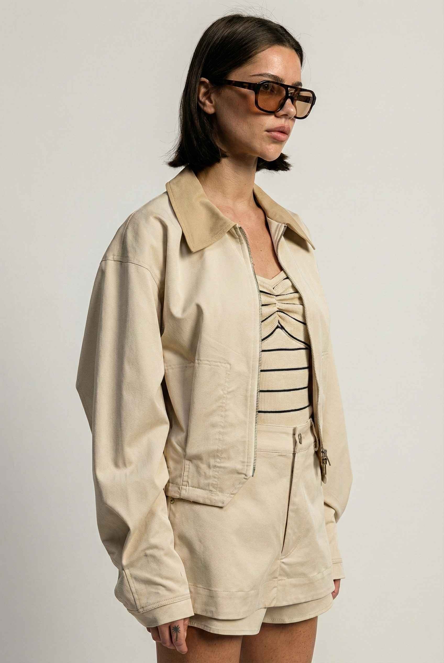 Model wearing Arlo Jacket | Beige Lyocell-Blend Jacket with Contrast Collar with striped shirt and shorts 