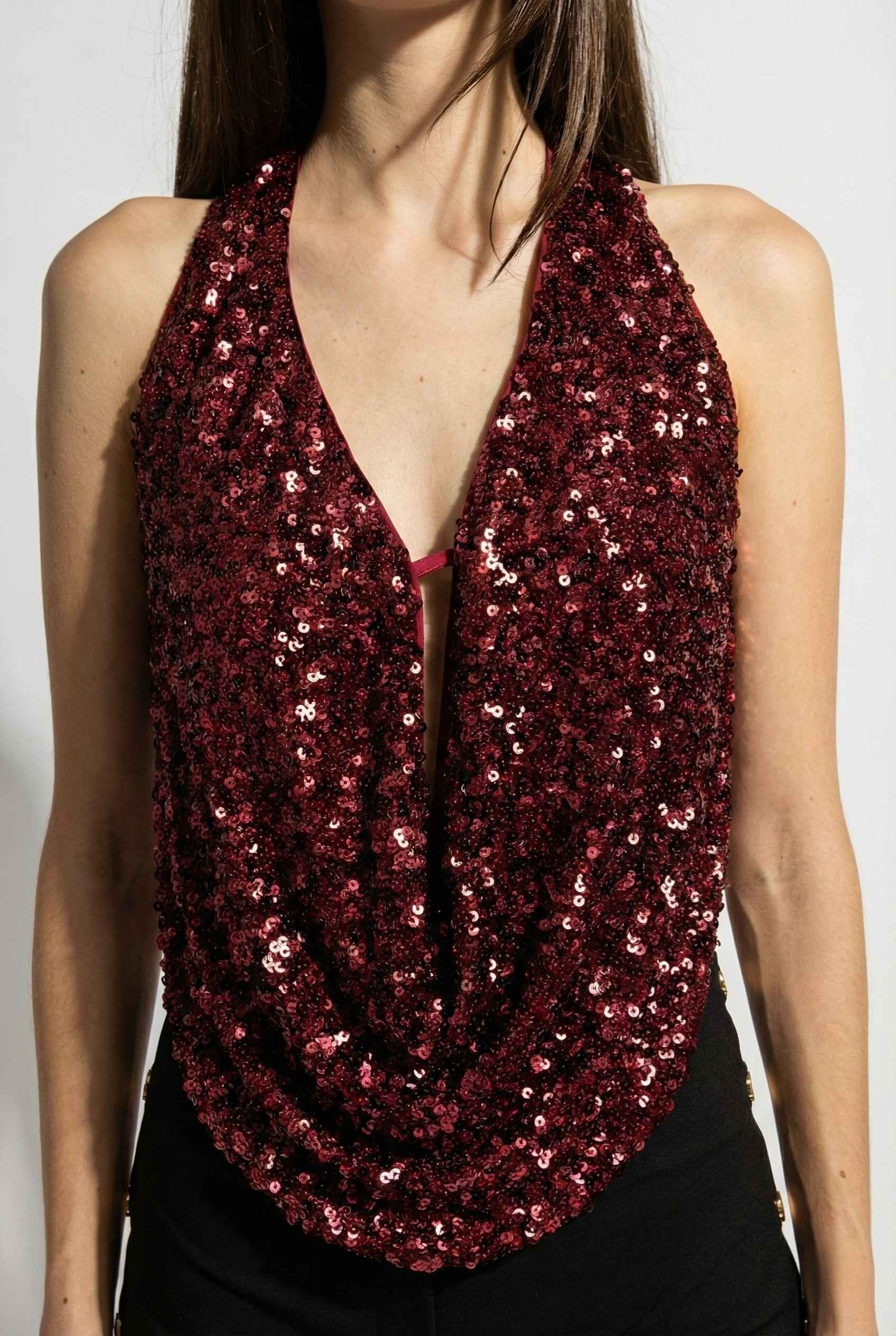 Astra Top Cherry Sequin Draped Halter Neck worn by a person on a white background
