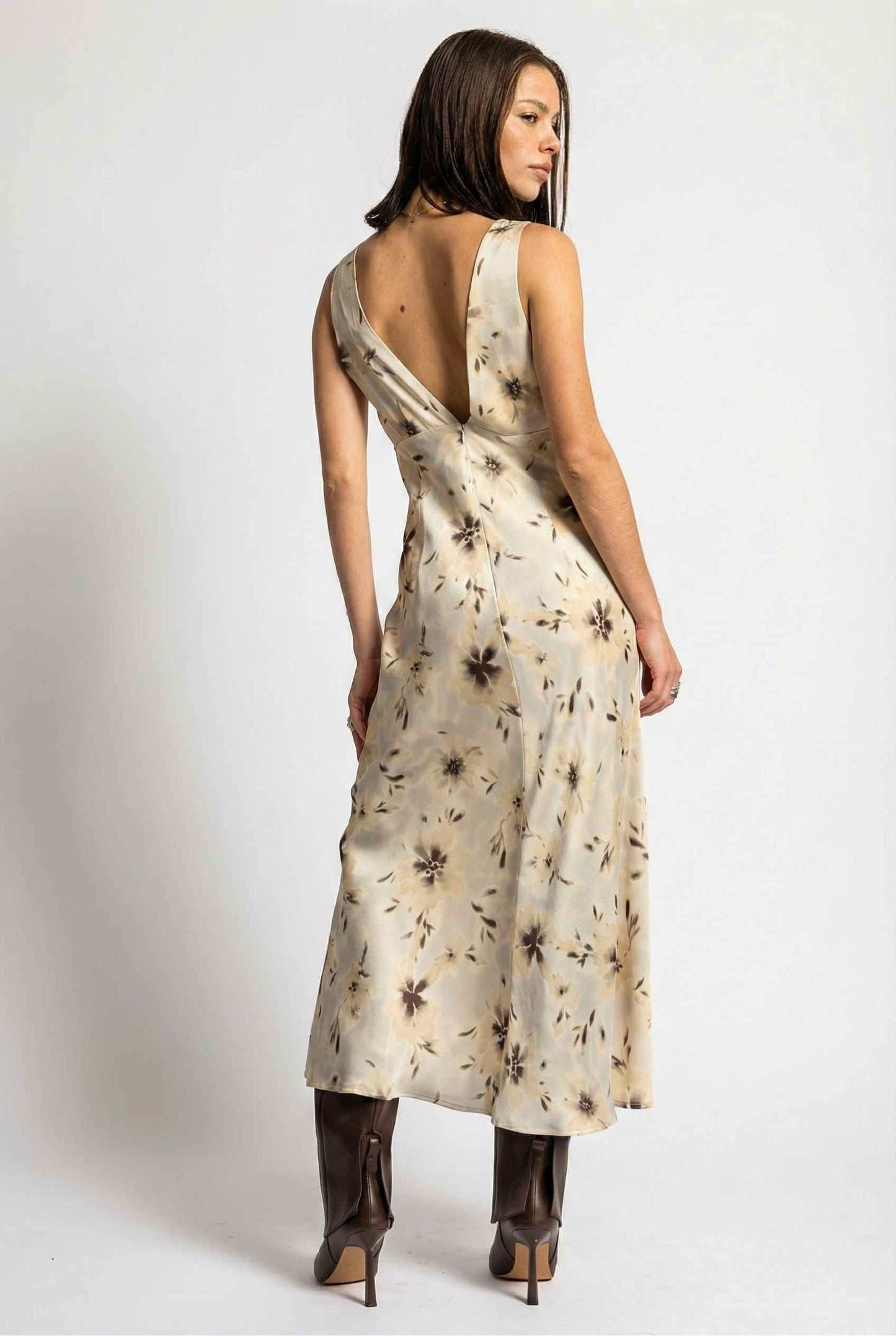 Woman wearing aAurelia Midi Ivory Sepia Floral V-Neck Slit Dress with a plain background