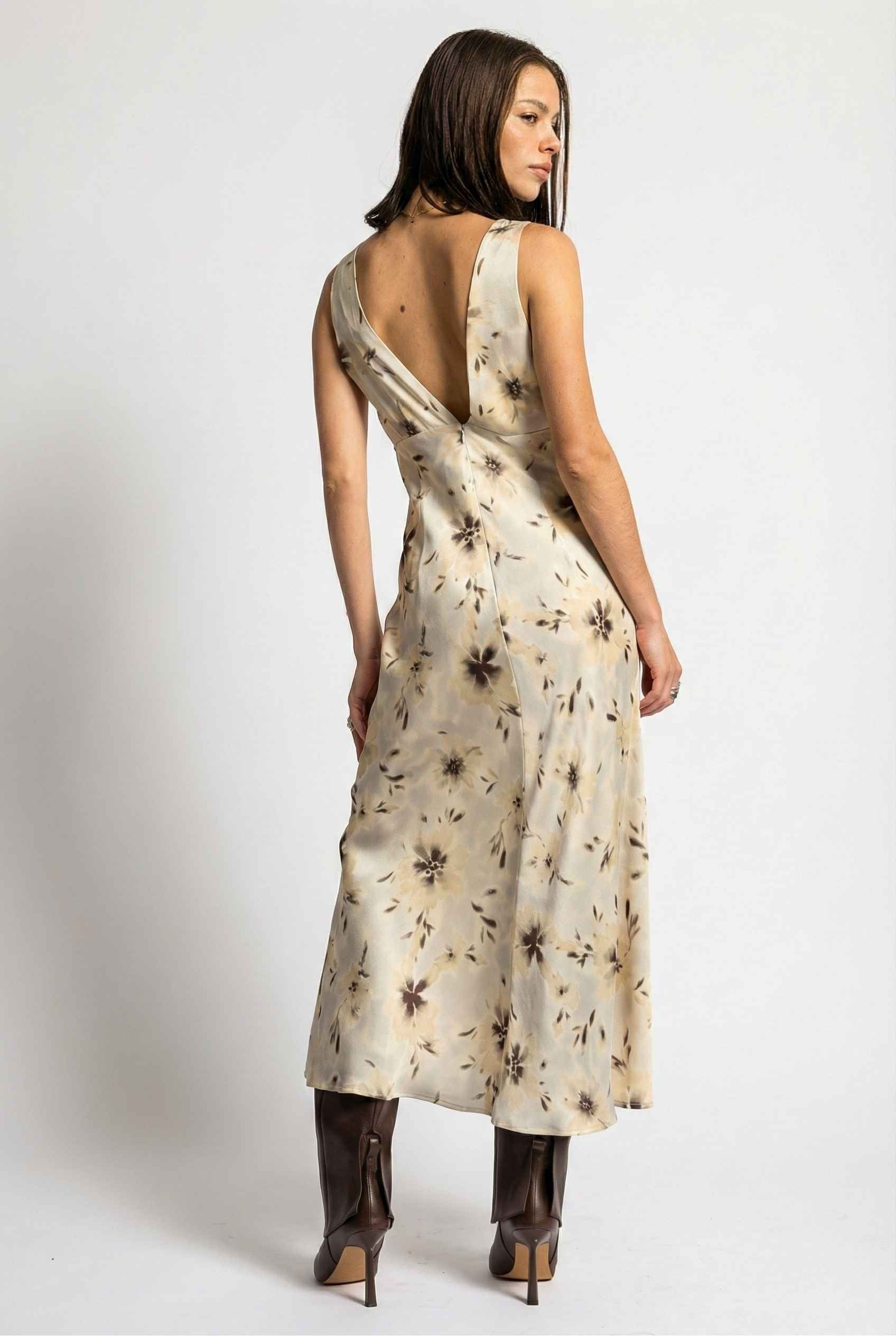 Woman wearing aAurelia Midi Ivory Sepia Floral V-Neck Slit Dress with a plain background