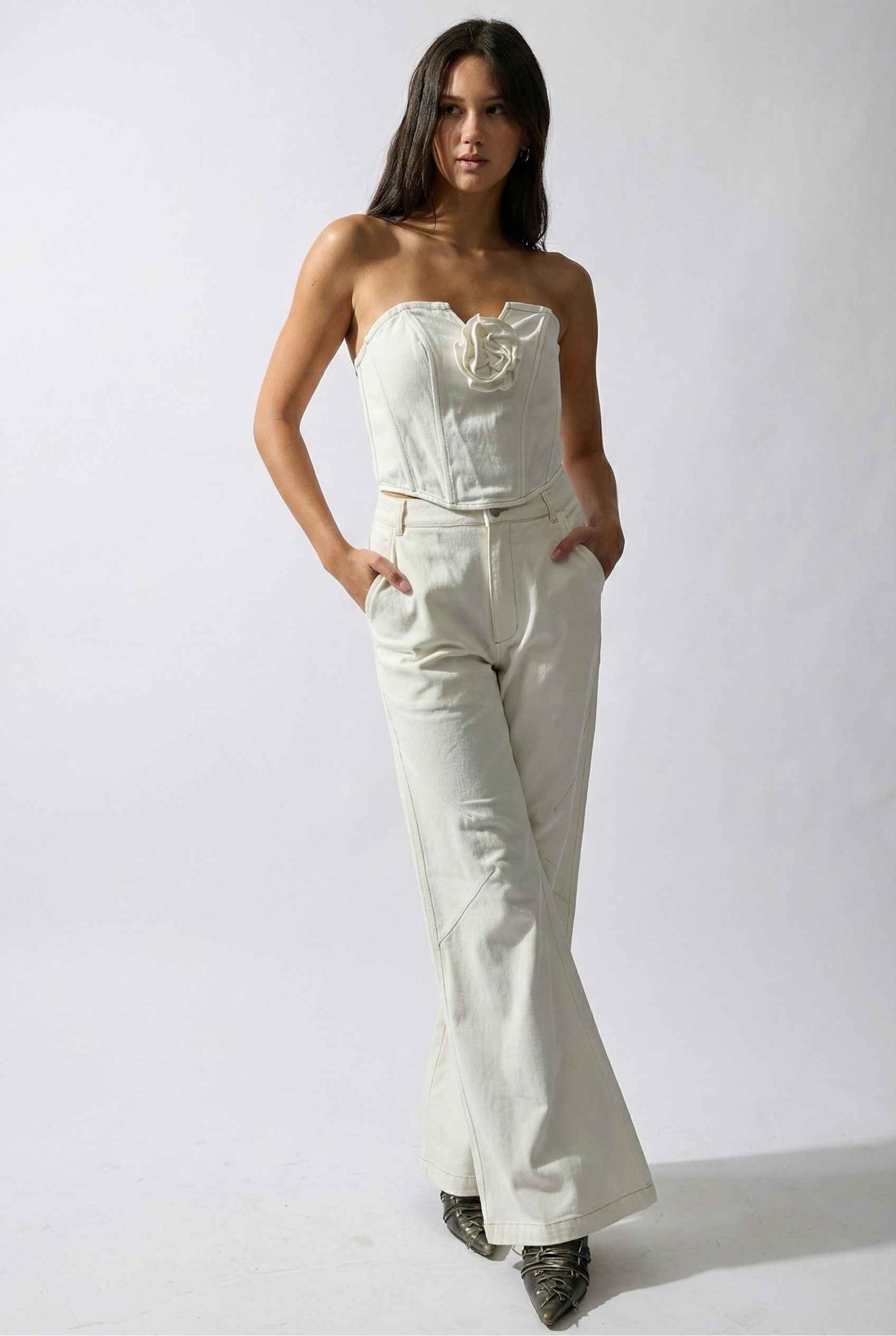 Model wearing Bianca Pants in Off White Cotton-Stretch Seamed Wide-Leg Trousers with matching corset top and heels against plain backdrop