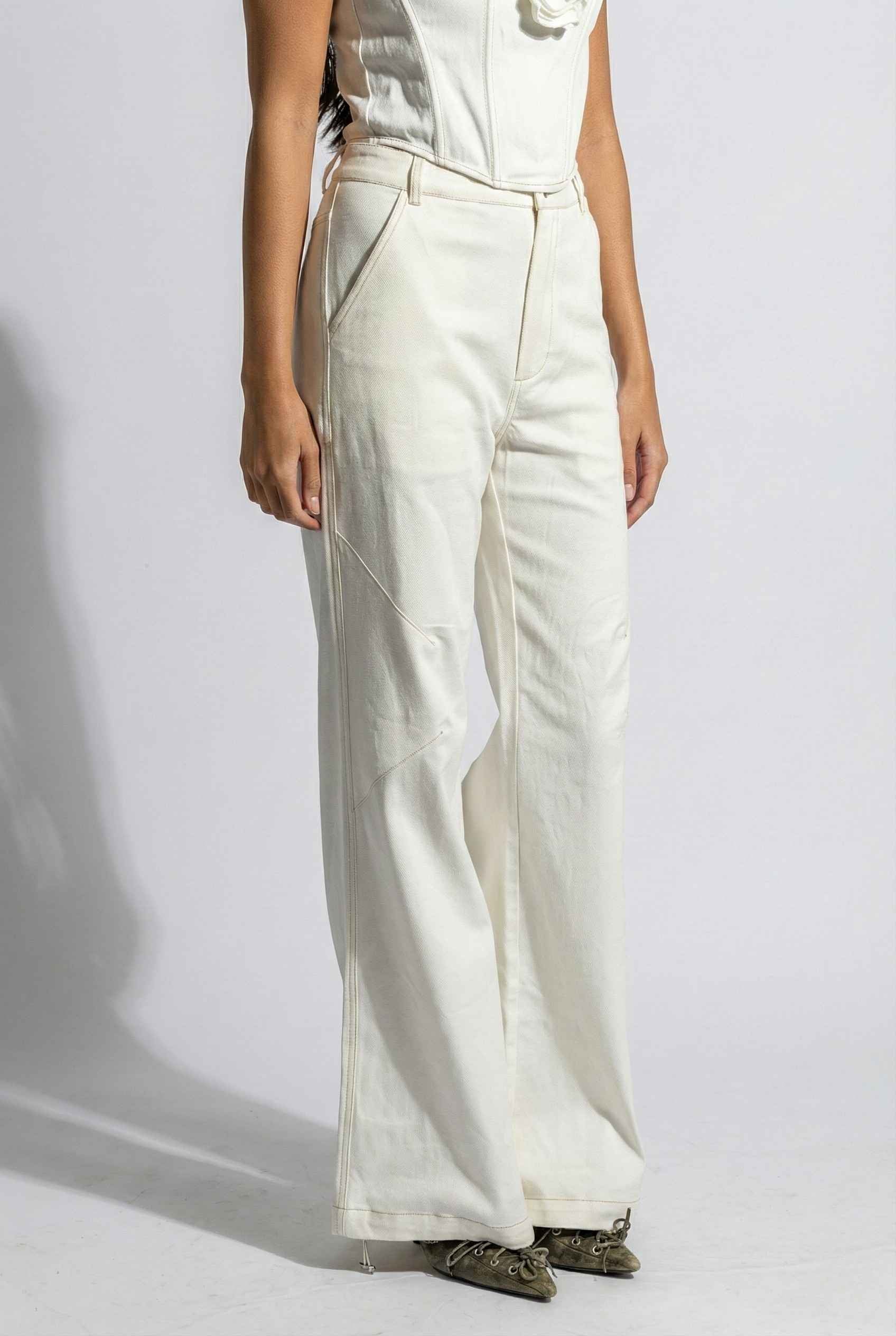 Model wearing Bianca Pants in Off White Cotton-Stretch Seamed Wide-Leg Trousers with matching corset top and heels against plain backdrop