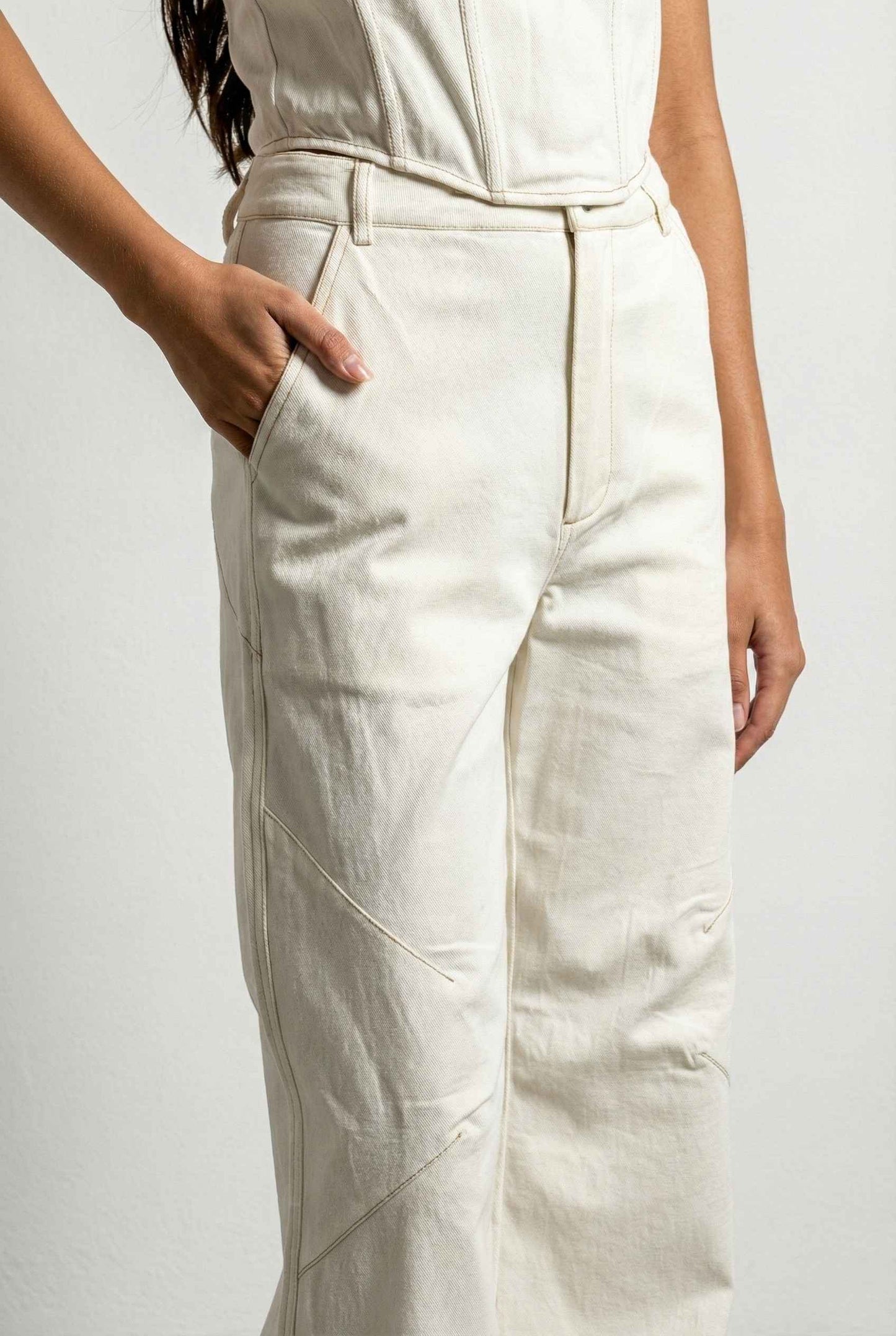 Model wearing Bianca Pants in Off White Cotton-Stretch Seamed Wide-Leg Trousers with matching corset top and heels against plain backdrop