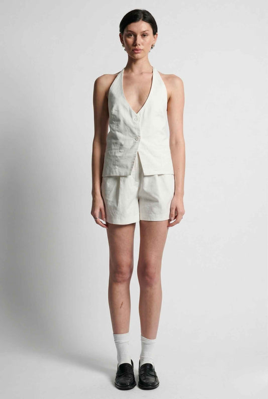 Woman wearing a Camille Shorts White High-Waist Pleated Linen-Cotton Tailored Shorts and shorts set on a plain background