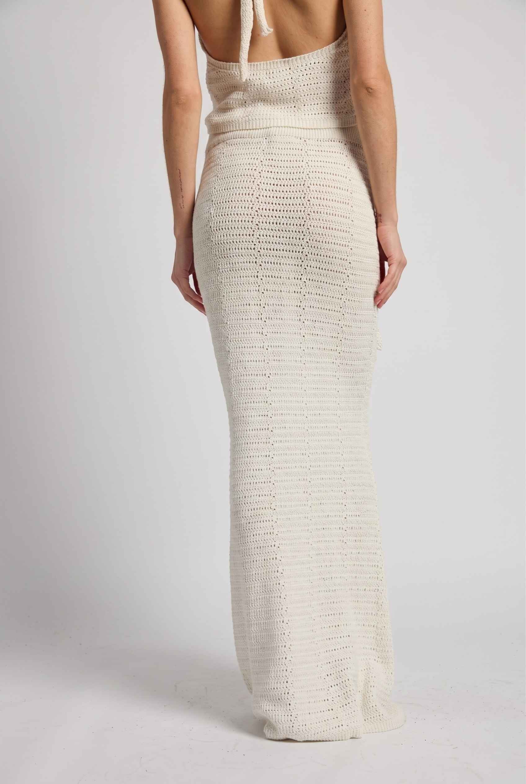 Model wearing Capri Floral Crochet Maxi Skirt in Ivory Cotton Knit Long Skirt paired with matching tank top back view