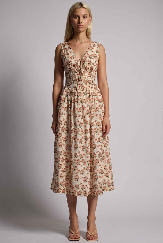 Model wearing Carolina Floral V-Neck Fit and Flare Dress Corset Midi Dress in Ivory paired with kitten heels