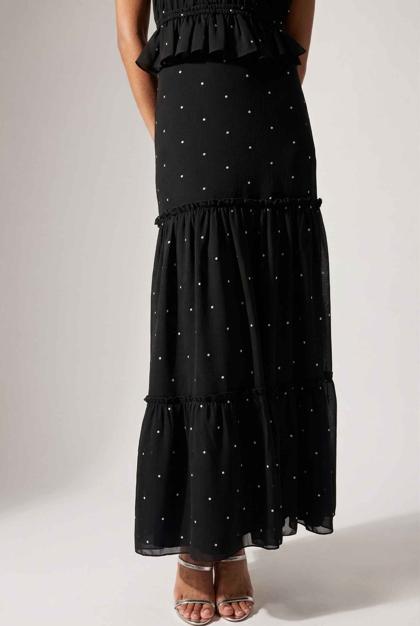 Clara Skirt Black Tiered Ruffle Polka Dot Midi Skirt on a plain background