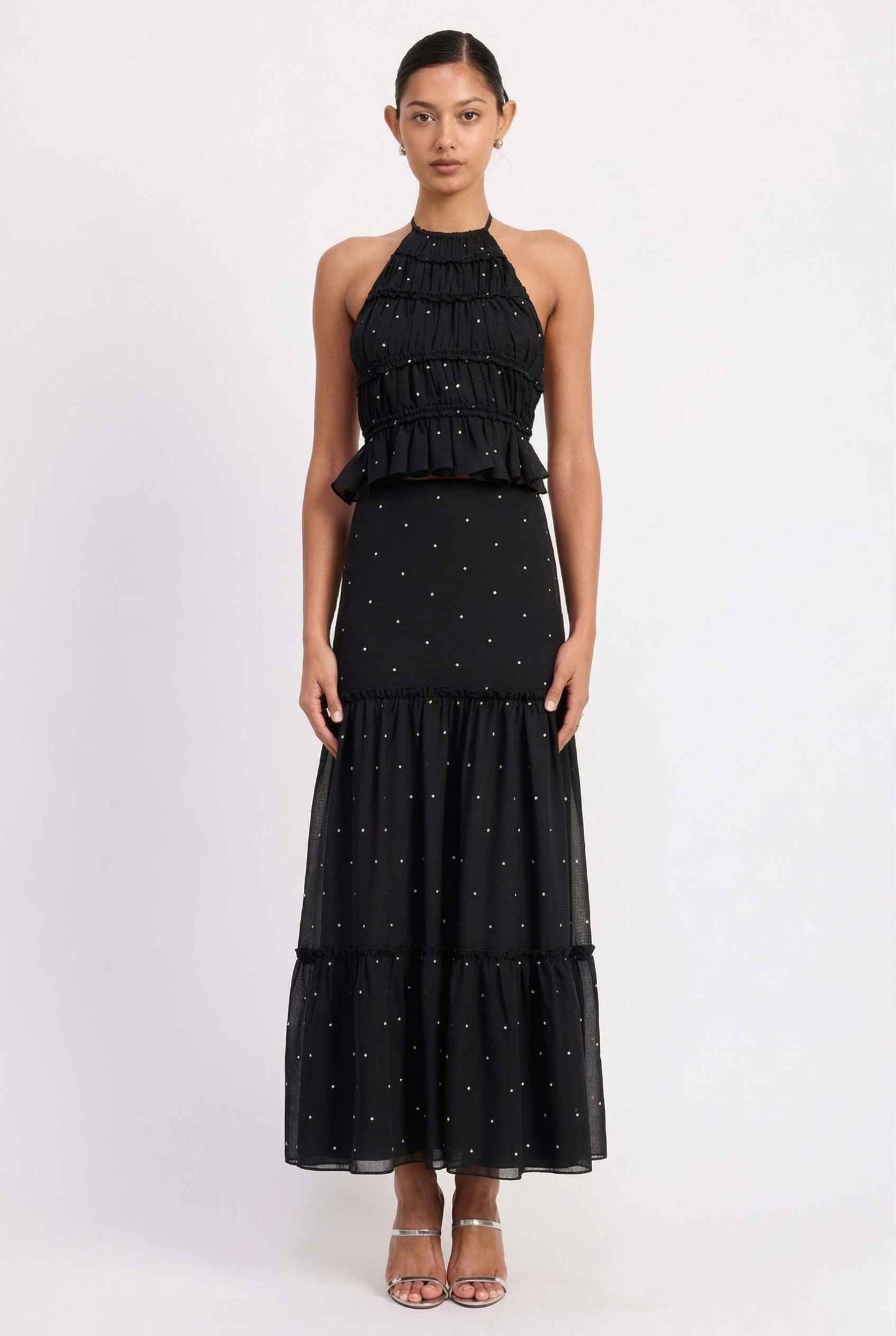 Clara Skirt Black Tiered Ruffle Polka Dot Midi Skirt with star patterns on a plain background