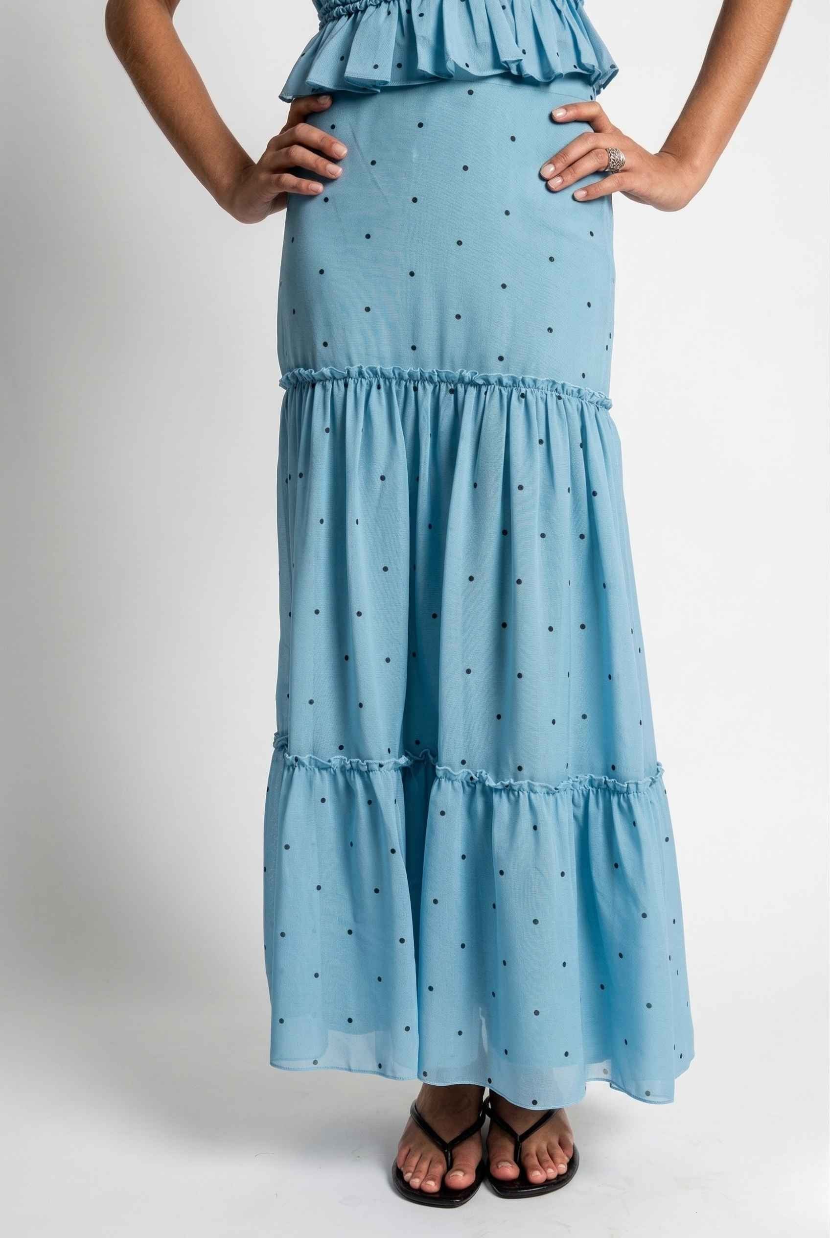 Clara Skirt Blue Tiered Ruffle Polka Dot Midi Skirt with ruffled layers on a plain background