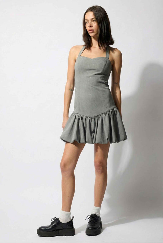 Woman wearing a Colette Mini Grey Rhinestone Drop-Waist Bubble Dress with a white background