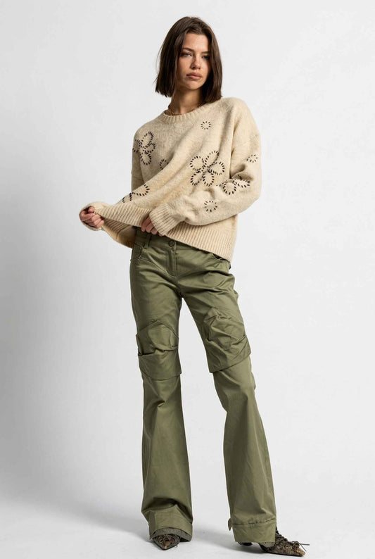 Model wearing Dahlia Sweater in Cream Crew Neck with Floral Embroidery paired with cargo pants and pointed heels