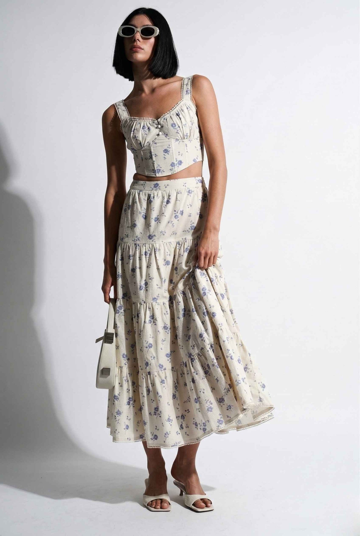 Woman wearing aEliana Top White & Blue Floral Cotton Corset Crop on a white background