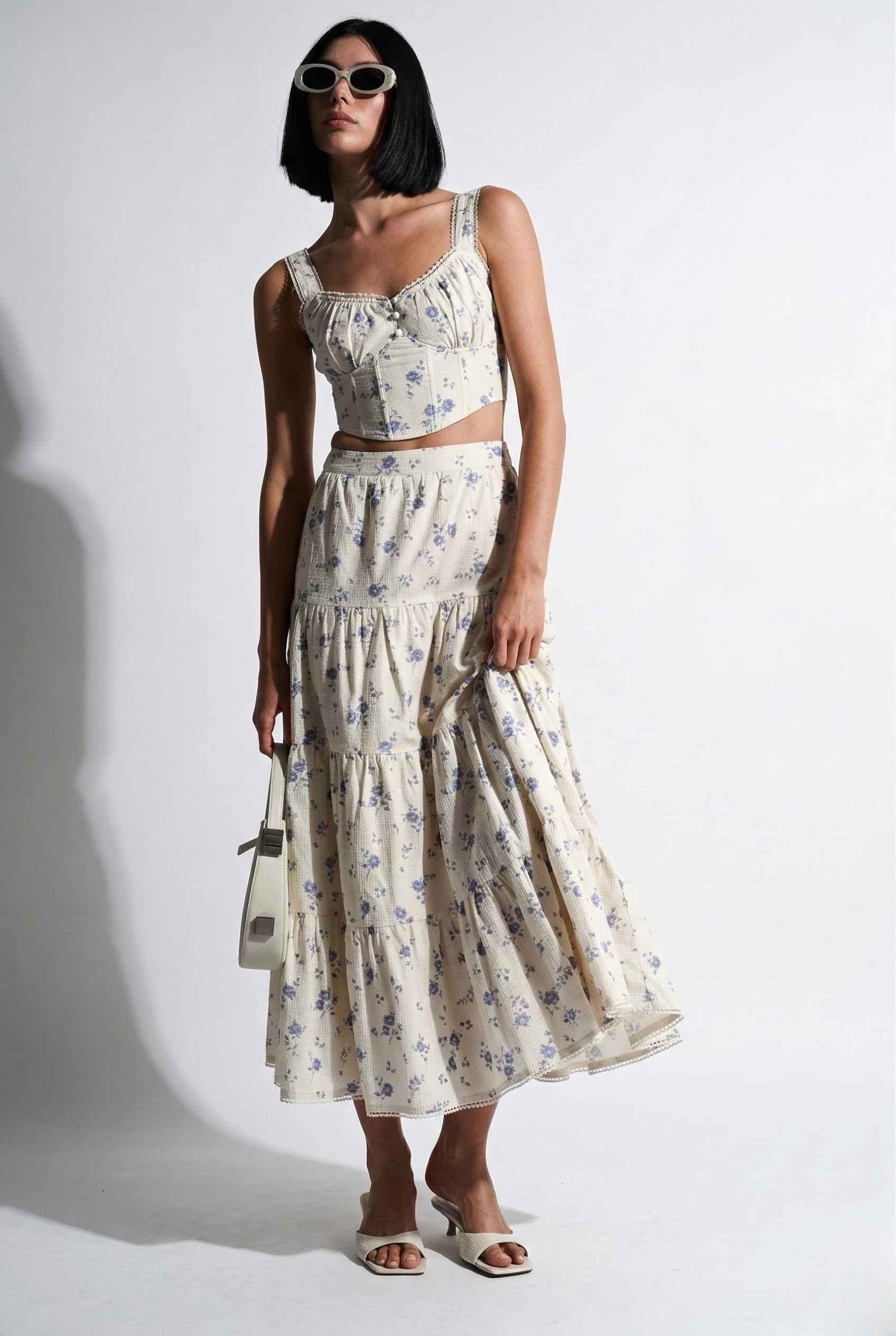 Woman wearing aEliana Top White & Blue Floral Cotton Corset Crop on a white background