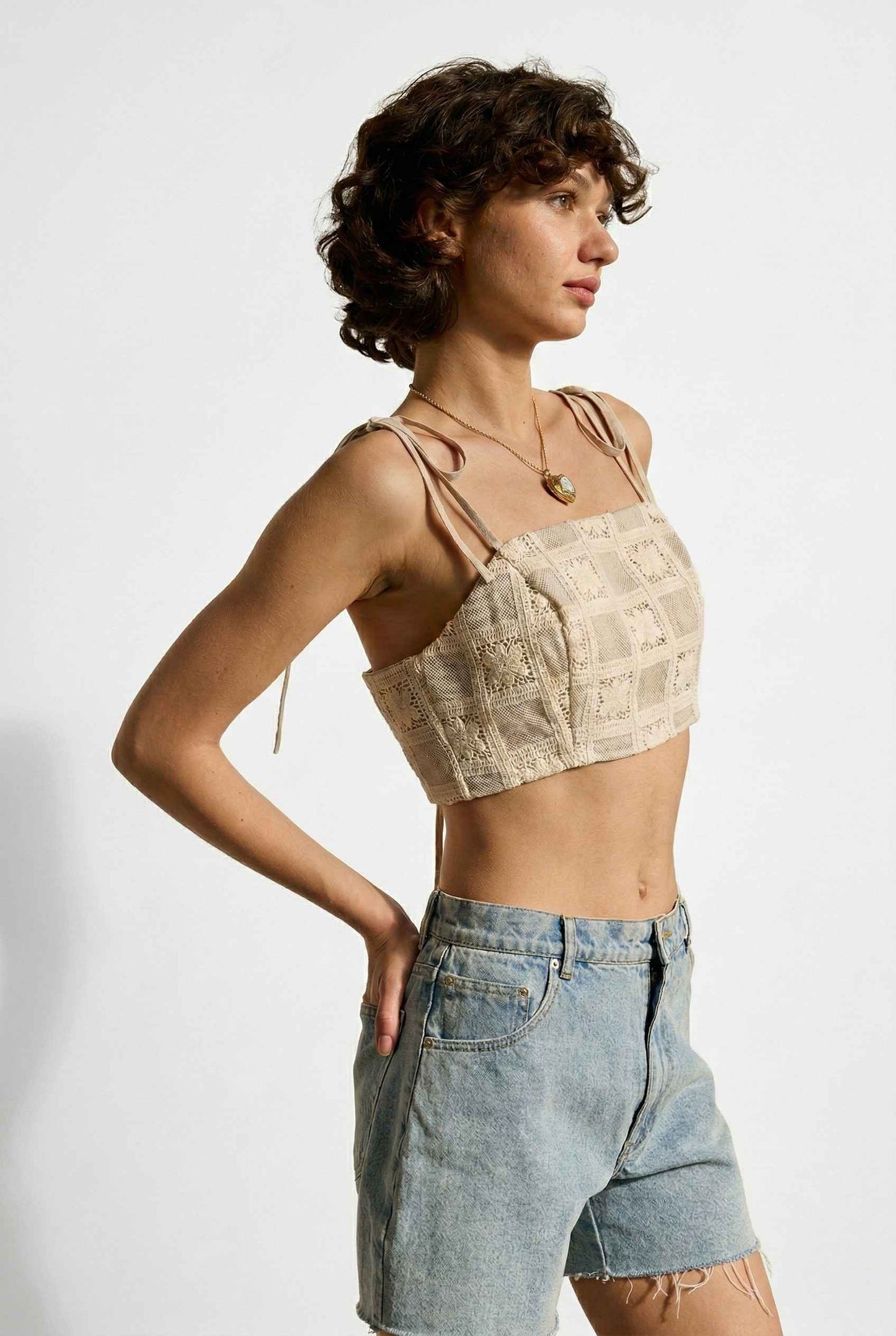 Model wearing Elodie Top in Natural Jacquard Square Neck Cami with Ribbon Tie Straps with denim shorts  on a plain background